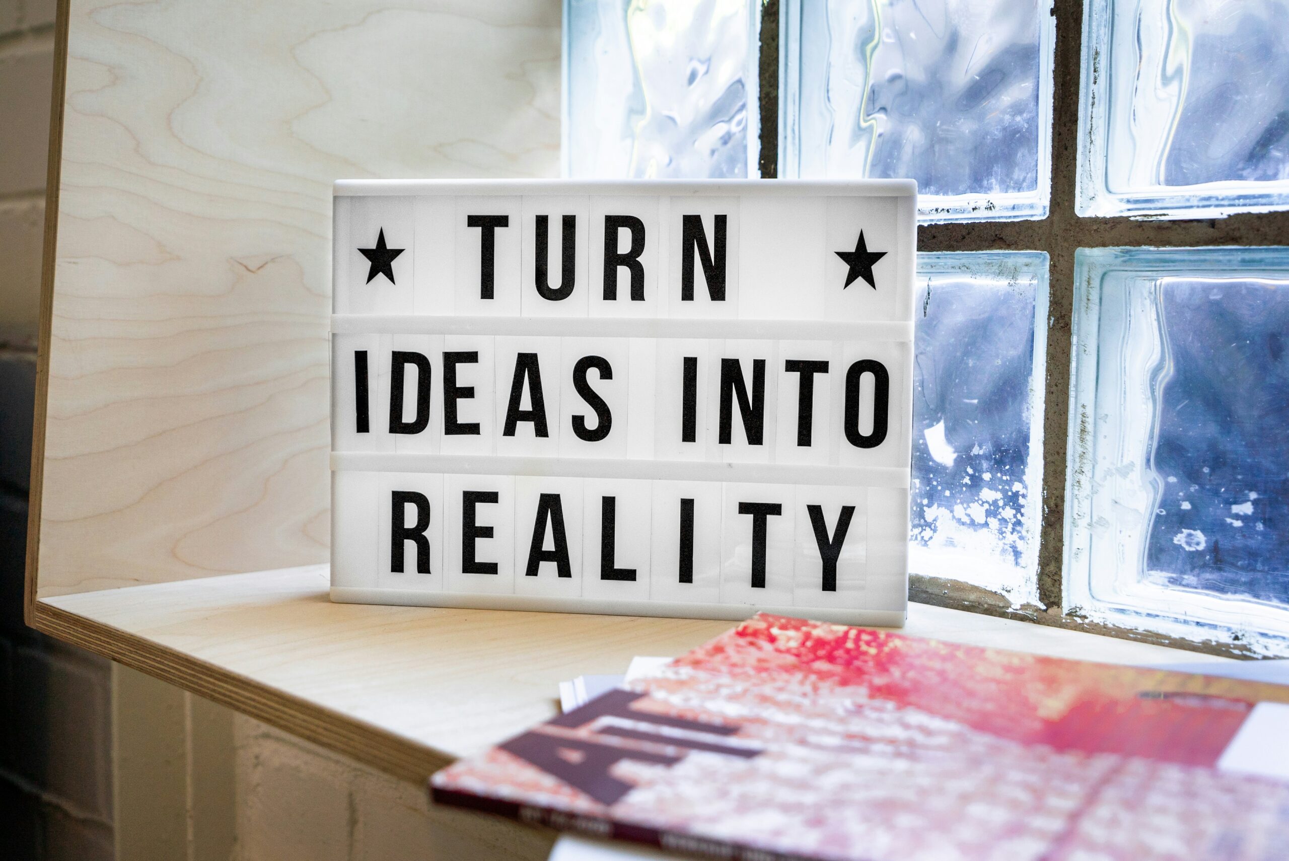 Lightbox sign reading "Turn ideas into reality